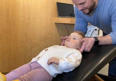 Chiropractor Moorhead MN Dr. Jace Foss Adjusting Child Chiropractor Moorhead MN Dr. Jace Foss Adjusting Child